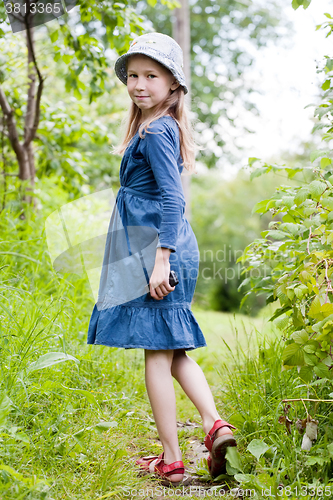 Image of little girl in blue dress