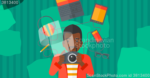 Image of Man holding camera.