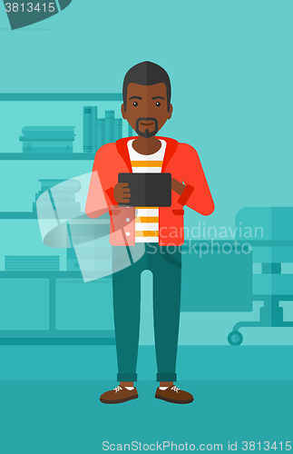 Image of Man using tablet computer.