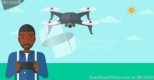 Image of Man flying drone.