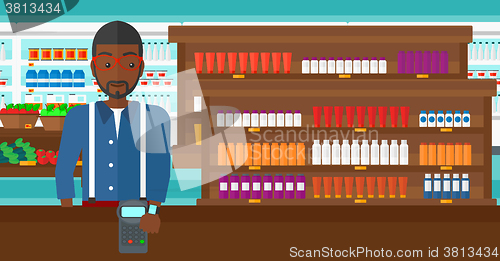 Image of Man paying with smart watch.