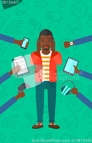 Image of Desperate man with gadgets.