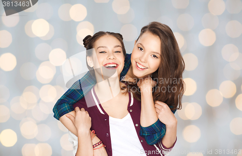 Image of happy smiling pretty teenage girls hugging