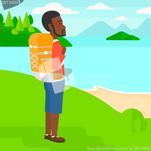 Image of Man with backpack hiking.
