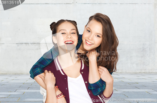 Image of happy smiling pretty teenage girls hugging