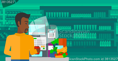 Image of Cashier at supermarket checkout.