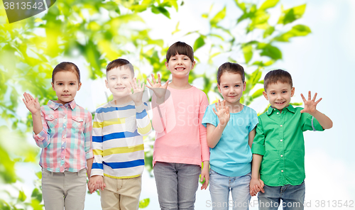 Image of happy smiling little children holding hands