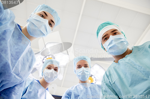 Image of group of surgeons in operating room at hospital