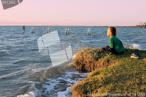 Image of boy looking over lake