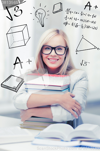 Image of student with stack of books and doodles