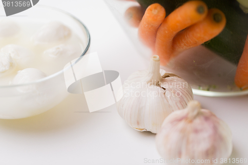 Image of close up of garlic, carrot and mozzarella cheese