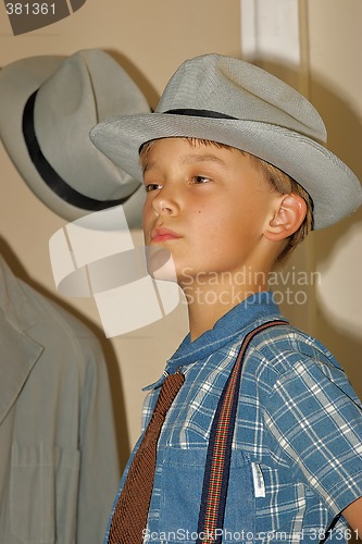 Image of boy trying hat