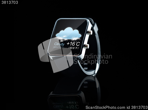 Image of close up of black smart watch with weather app