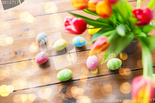 Image of close up of easter eggs and flowers in bucket