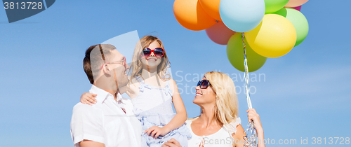 Image of family with colorful balloons