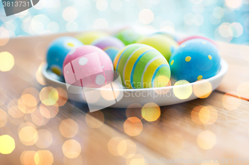 Image of close up of colored easter eggs on plate