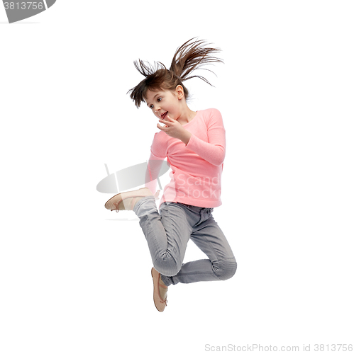Image of happy little girl jumping in air