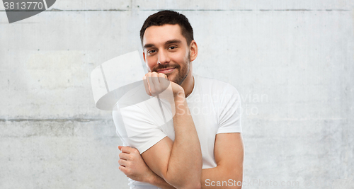 Image of smiling man over gray background