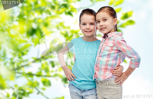 Image of happy smiling little girls hugging