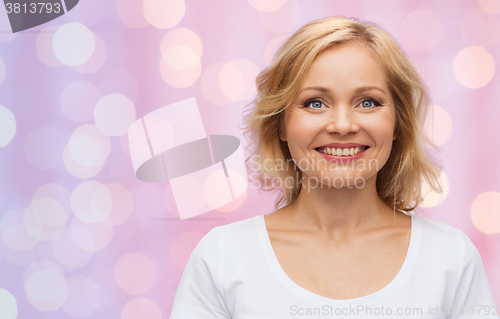 Image of smiling woman in blank white t-shirt