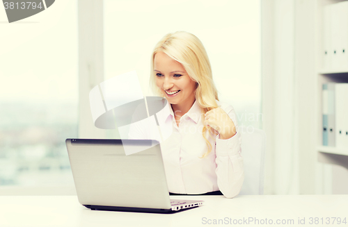 Image of smiling businesswoman or student with laptop