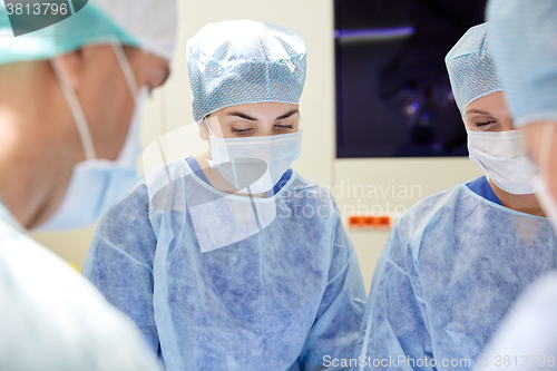 Image of group of surgeons in operating room at hospital