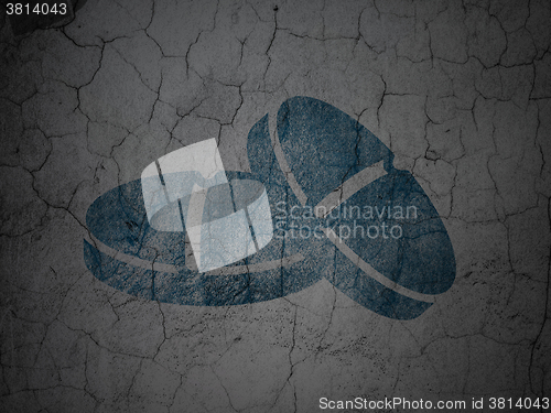 Image of Health concept: Pills on grunge wall background