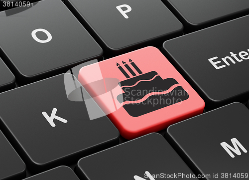 Image of Entertainment, concept: Cake on computer keyboard background