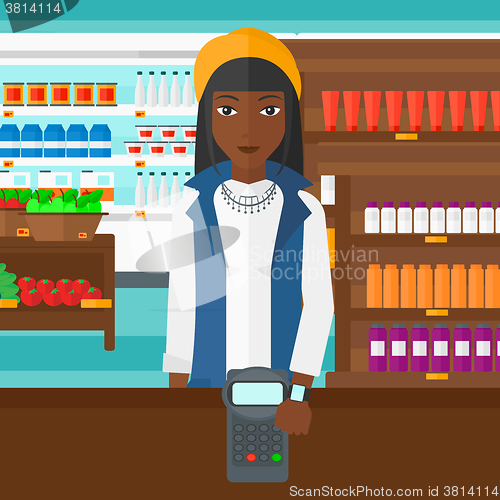 Image of Woman paying with smart watch.