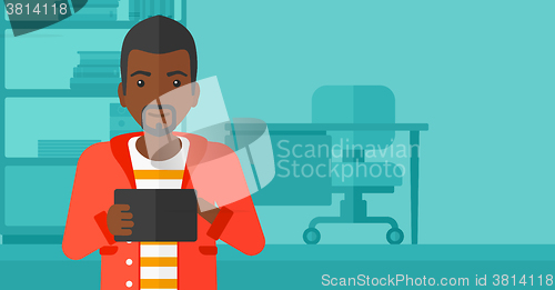 Image of Man using tablet computer.