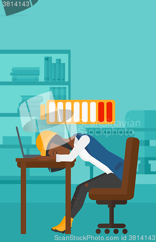 Image of Employee sleeping at workplace.