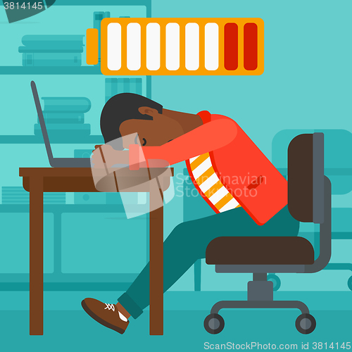 Image of Employee sleeping at workplace.