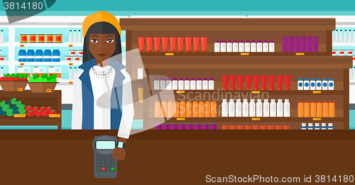 Image of Woman paying with smart watch.