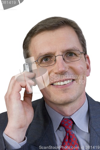 Image of Smiling businessman with cell phone