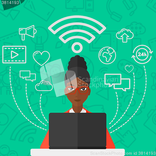 Image of Woman working on laptop.