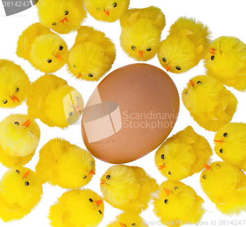 Image of Easter chicks surrounding a large egg