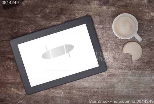Image of Tablet touch computer gadget on wooden table