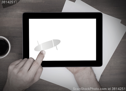 Image of Tablet touch computer gadget on wooden table