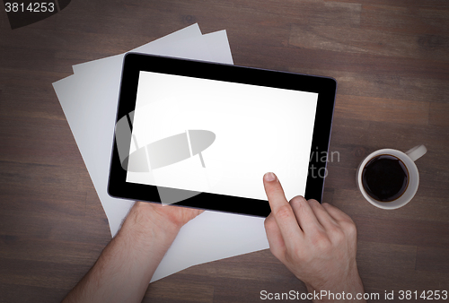 Image of Tablet touch computer gadget on wooden table