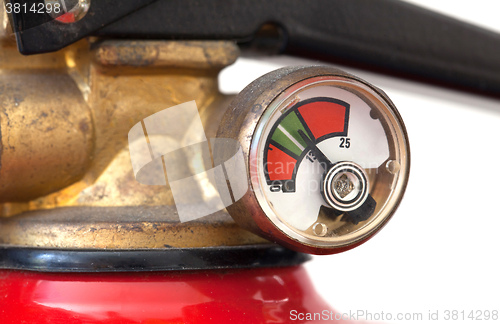 Image of Dusty fire extinguisher fully charged, selective focus