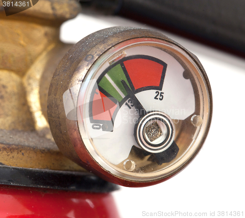 Image of Dusty fire extinguisher fully charged, selective focus