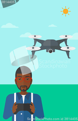 Image of Man flying drone.