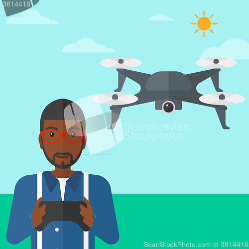 Image of Man flying drone.