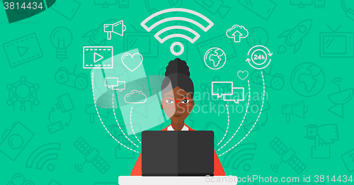 Image of Woman working on laptop.
