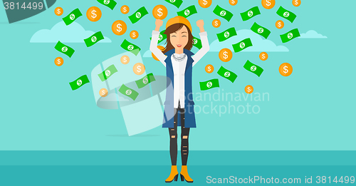 Image of Happy woman with  flying money. 