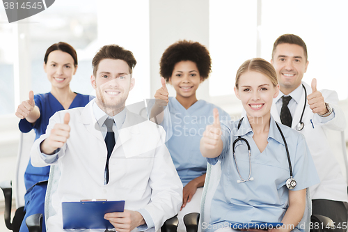 Image of group of happy doctors on seminar at hospital