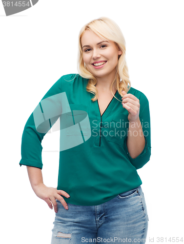 Image of smiling young woman in shirt and jeans
