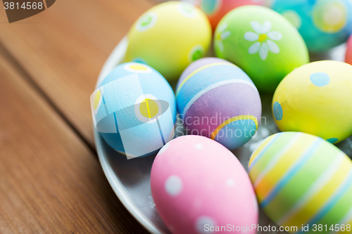 Image of close up of colored easter eggs on plate