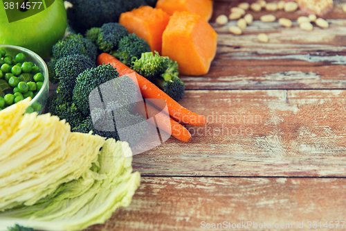 Image of close up of ripe vegetables on wooden table