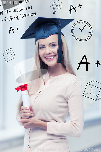 Image of student in graduation cap with certificate